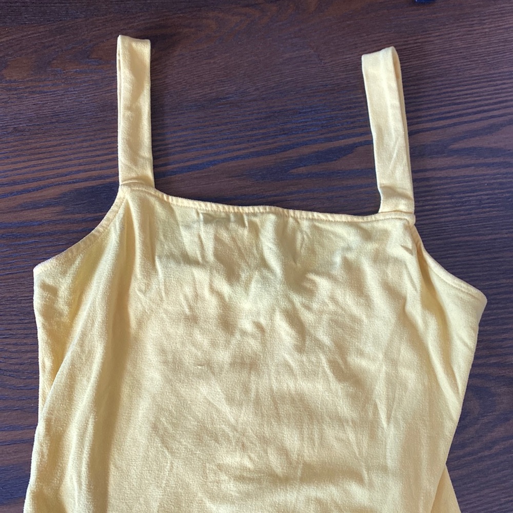 Bright yellow bodysuit